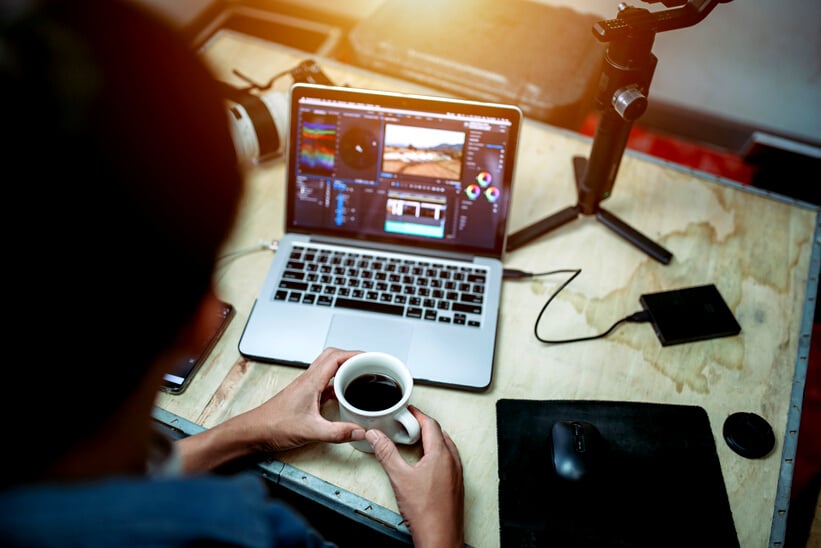 Content creator desk and equipment coffee cup and a laptop external hard disk in the house studio